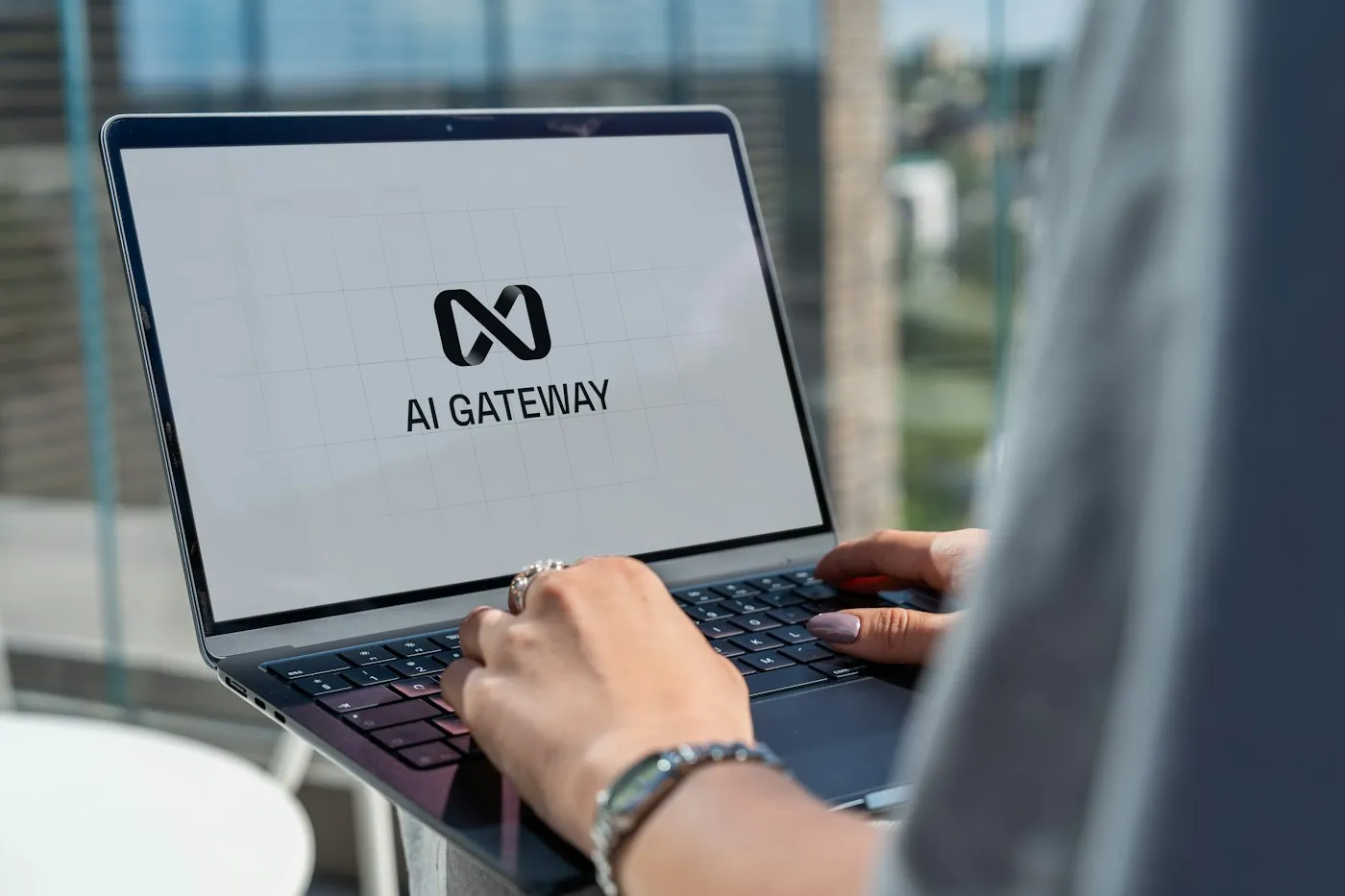 Person typing on a laptop using an AI tool