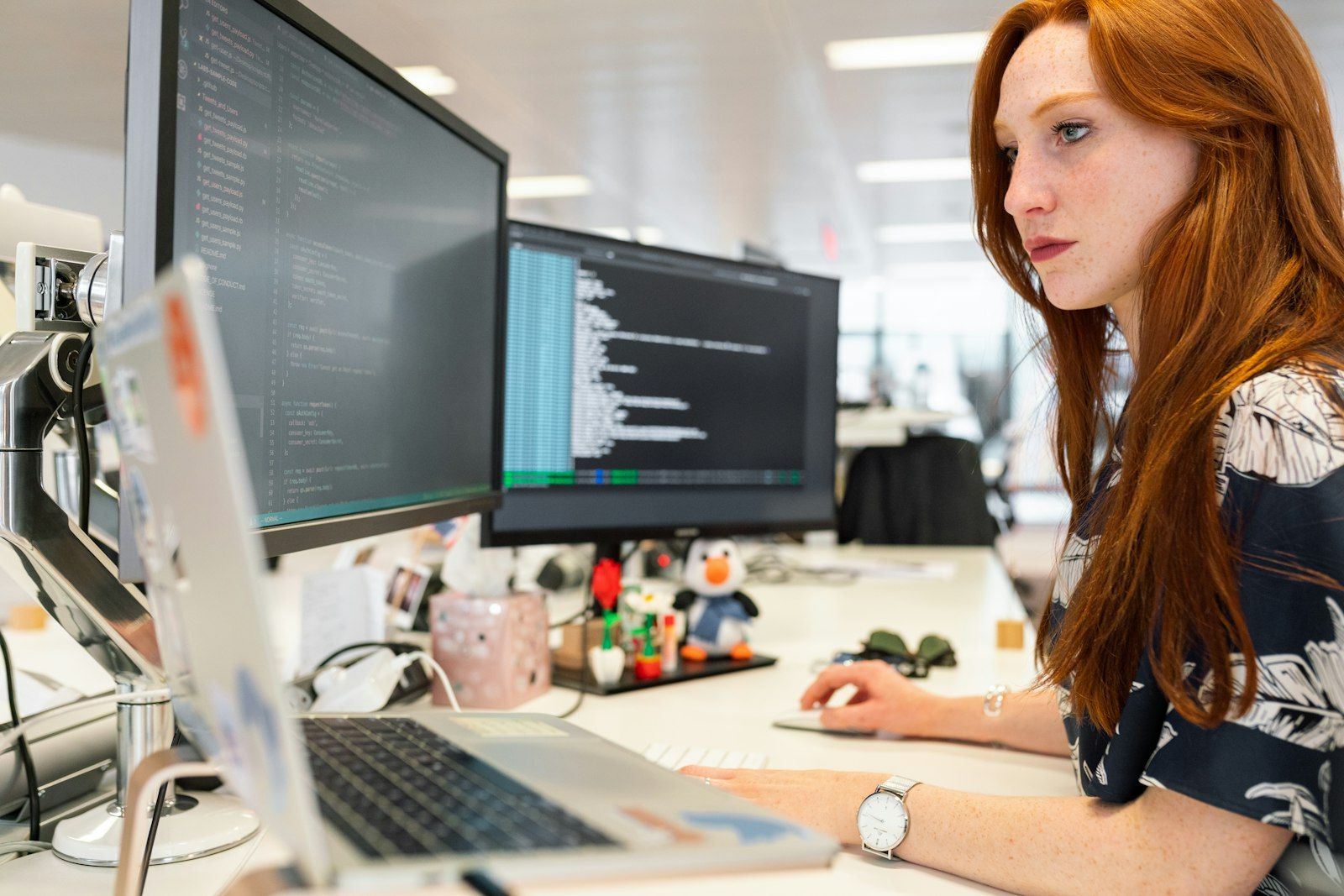Software engineer working at a computer in a modern office